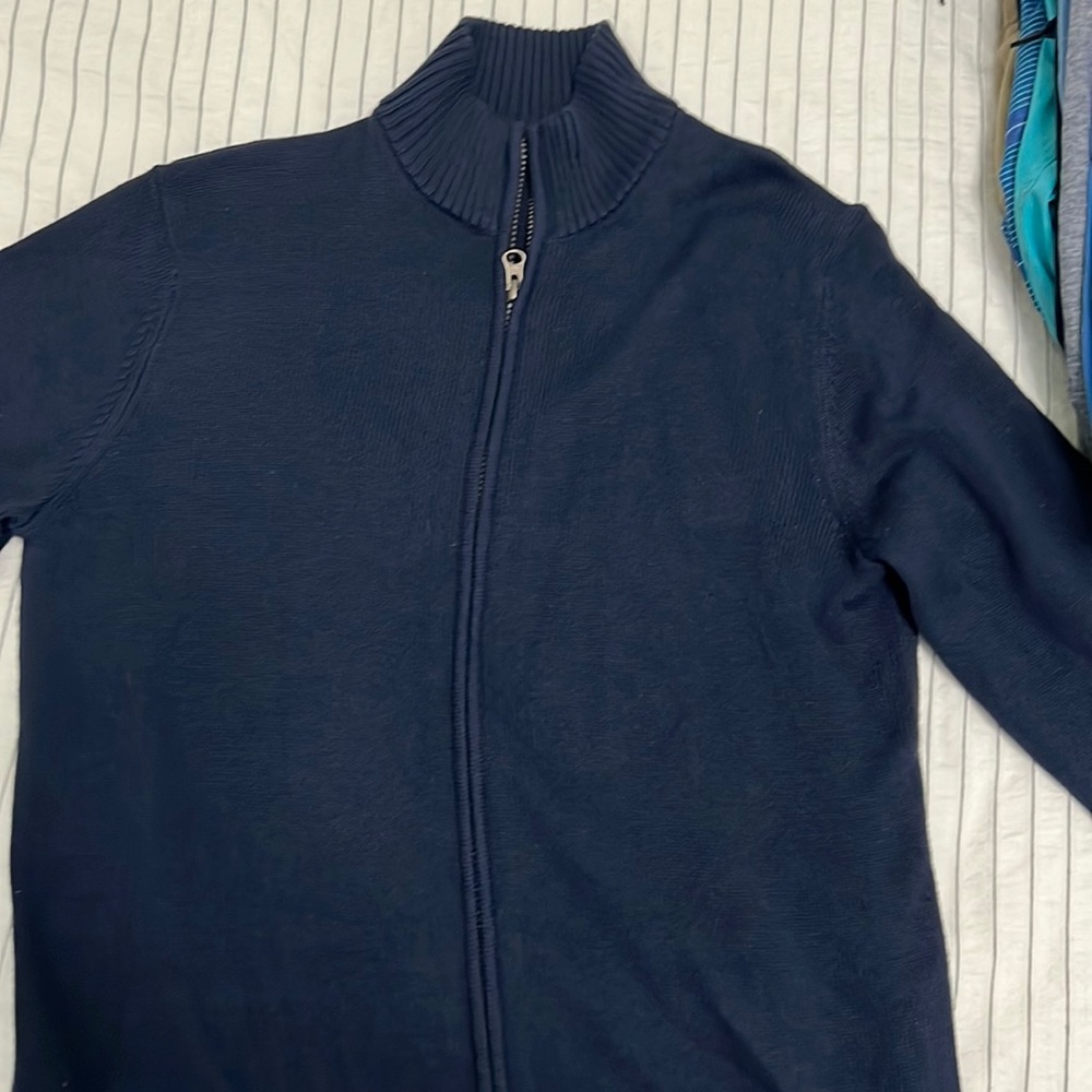 Uniform sweater.